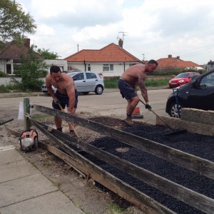 Battens laying the permeable tarmac.